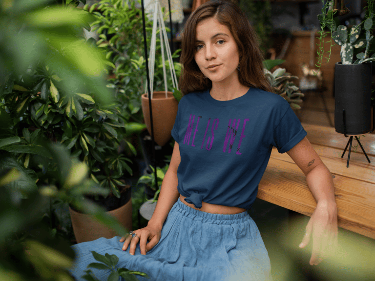 A woman with OSDD sits on a wooden bench in front of a potted plant.
